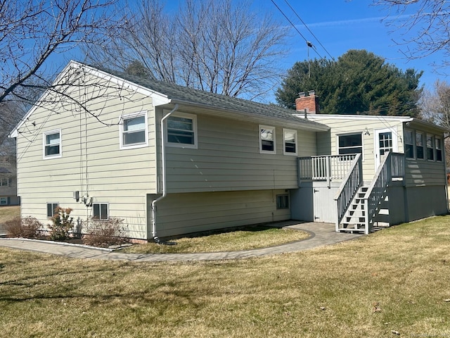 back of property featuring central air condition unit, stairs, a chimney, a yard, and a deck