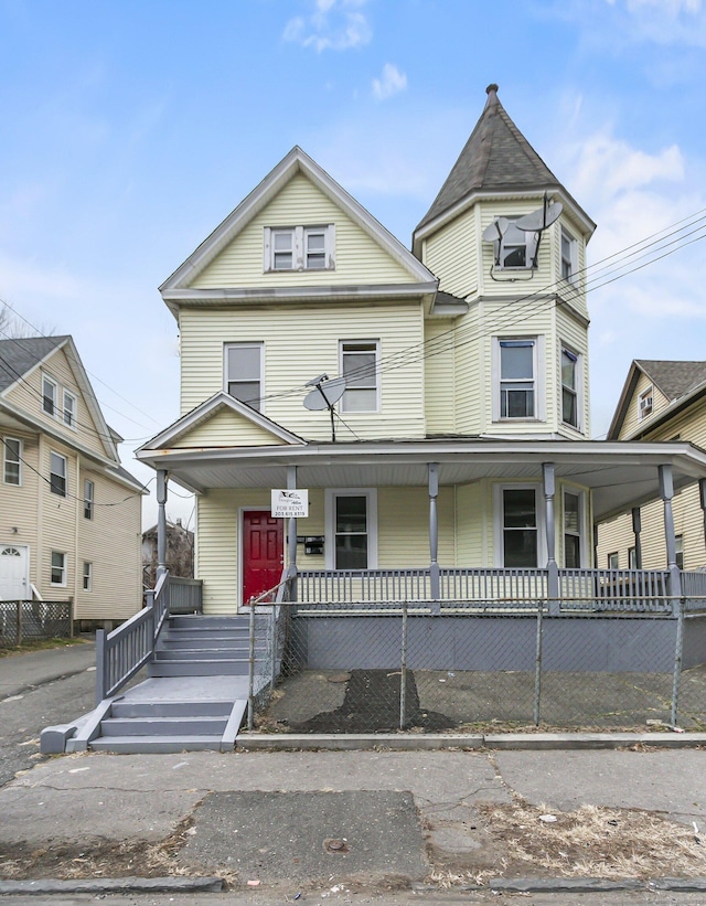 victorian house featuring a porch