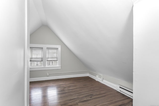 bonus room featuring baseboards, a baseboard heating unit, dark wood-type flooring, and vaulted ceiling