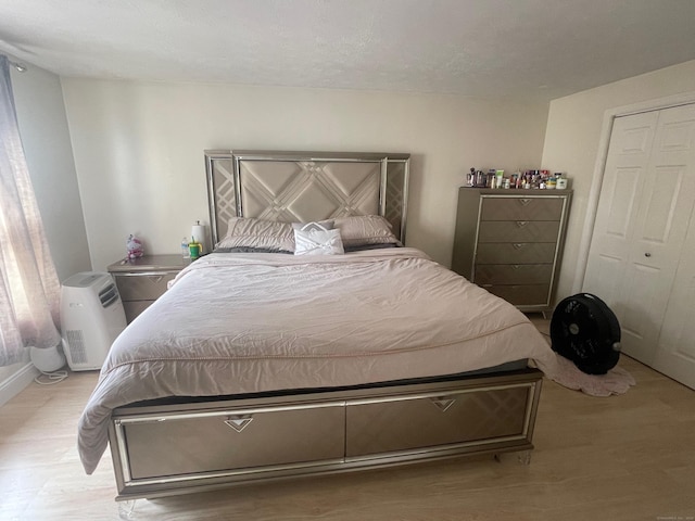 bedroom featuring wood finished floors