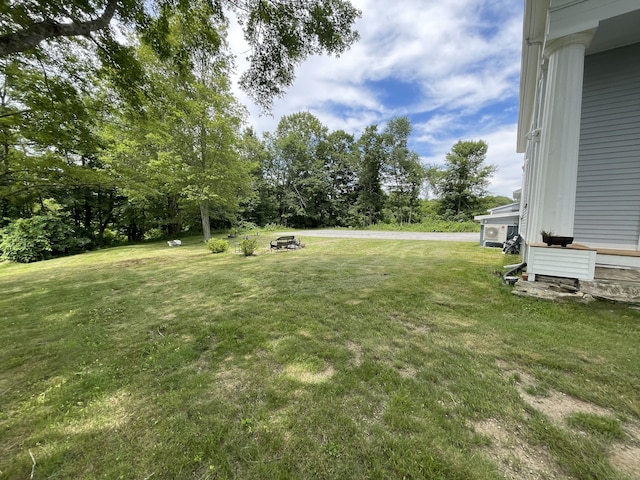 160 Halls Hill Rd, Killingly, CT 06239 - view of grassy yard featuring view of wooded area and an outdoor fire pit