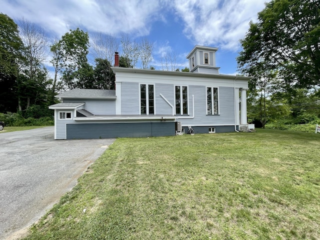 160 Halls Hill Rd, Killingly, CT 06239 - view of front facade with a front yard, driveway, and a chimney