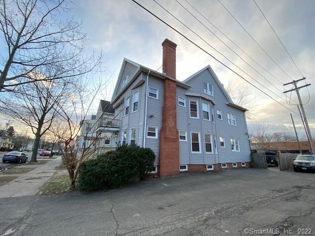 view of side of home with a chimney