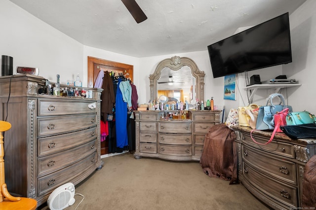 carpeted bedroom with a ceiling fan