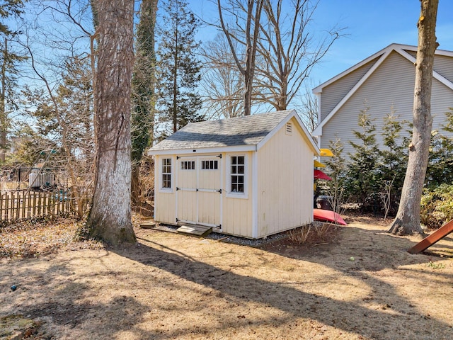 view of shed with fence