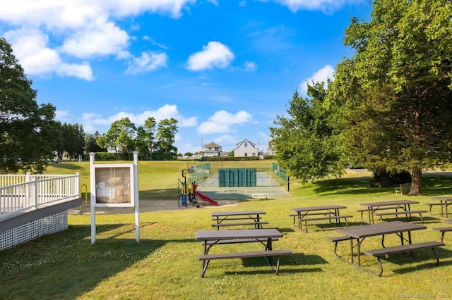 view of property's community with a yard