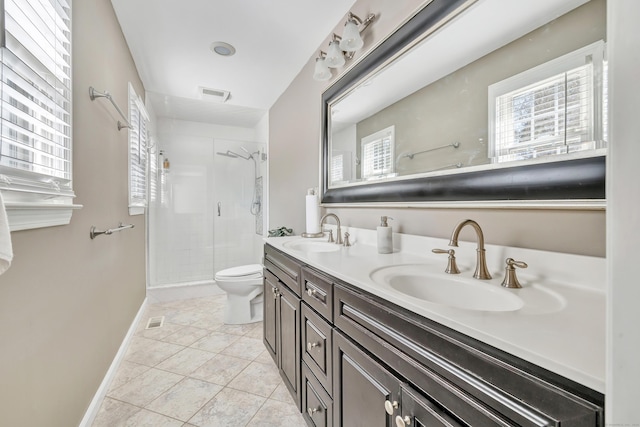 full bath featuring a sink, visible vents, a stall shower, and double vanity