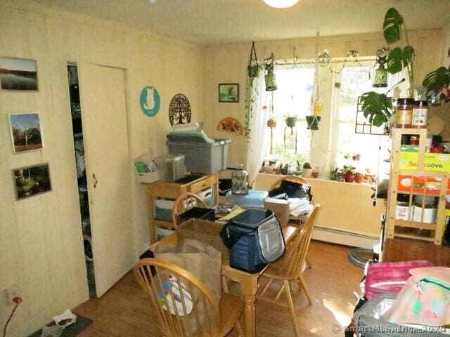 dining space with a baseboard heating unit