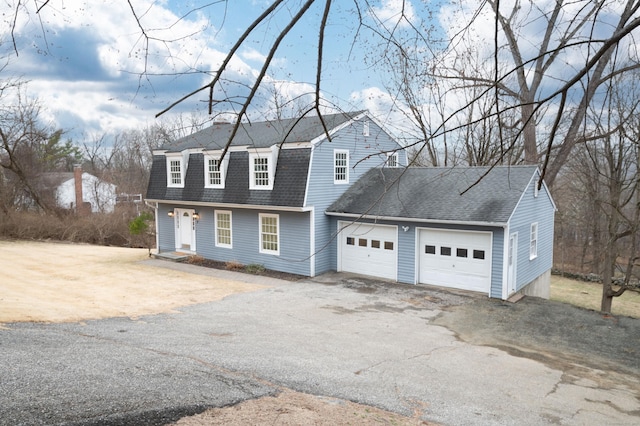 2 Old Middle Rd, Brookfield, CT 06804 - view of front of property featuring asphalt driveway, roof with shingles, a garage, a chimney, and a gambrel roof