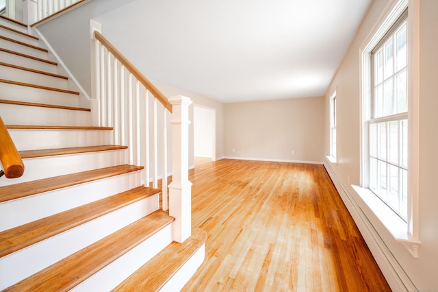 2 Old Middle Rd, Brookfield, CT 06804 - staircase with wood finished floors, healthy amount of natural light, baseboards, and a baseboard radiator