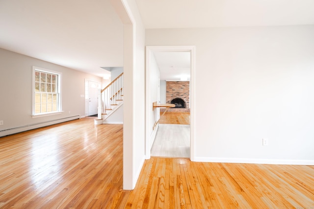 2 Old Middle Rd, Brookfield, CT 06804 - foyer entrance with a brick fireplace, stairs, light wood-style floors, baseboards, and a baseboard radiator