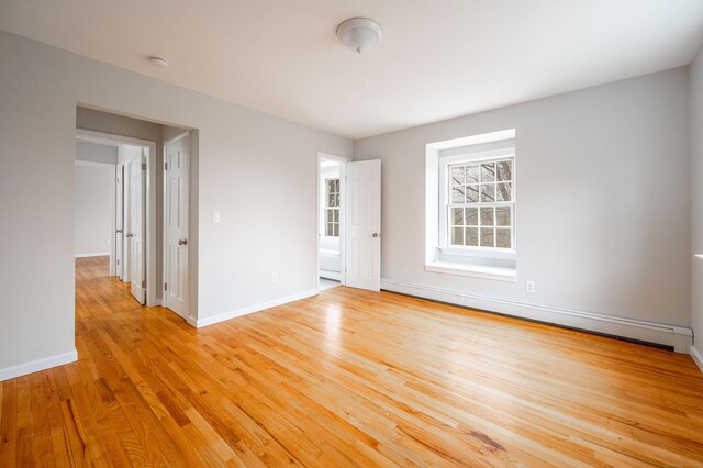 2 Old Middle Rd, Brookfield, CT 06804 - empty room featuring baseboard heating, light wood-style floors, and baseboards
