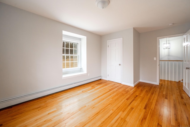 2 Old Middle Rd, Brookfield, CT 06804 - unfurnished bedroom featuring baseboard heating, light wood-type flooring, and baseboards