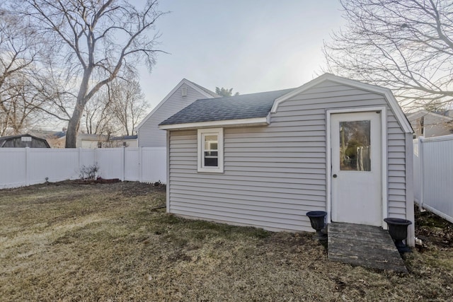 view of outdoor structure featuring a fenced backyard