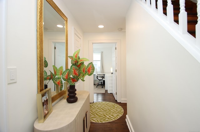 hallway with recessed lighting, baseboards, and dark wood-style floors