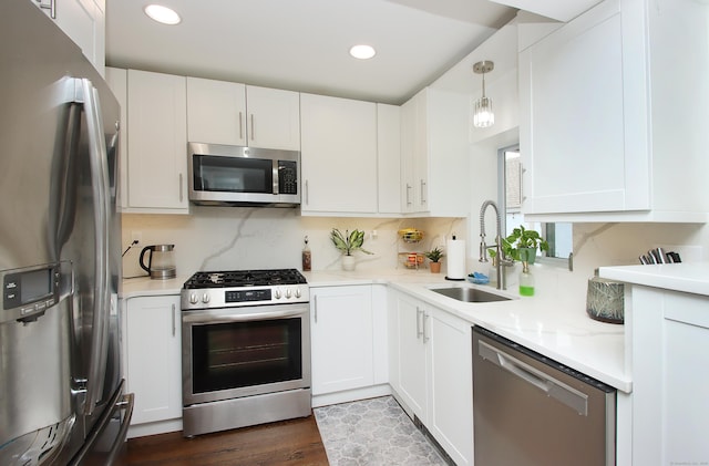 kitchen featuring tasteful backsplash, stainless steel appliances, and a sink
