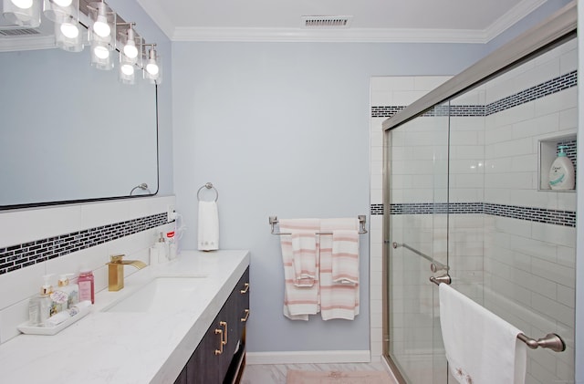full bath featuring vanity, visible vents, a stall shower, ornamental molding, and marble finish floor