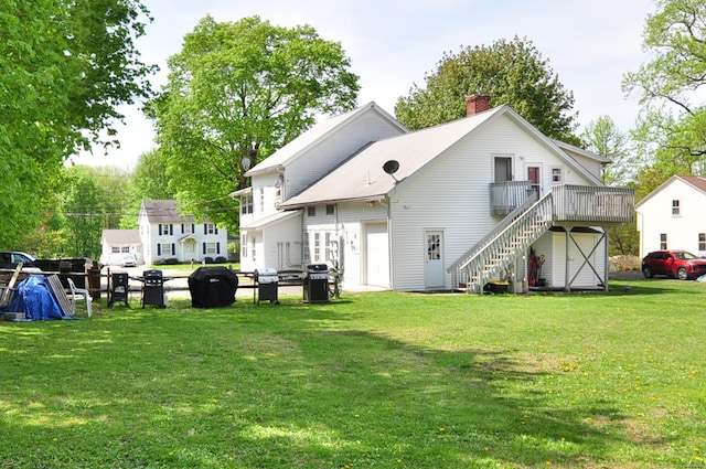 61 E St, Bethlehem, CT 06751 - rear view of property featuring stairway, a chimney, a yard, and a deck