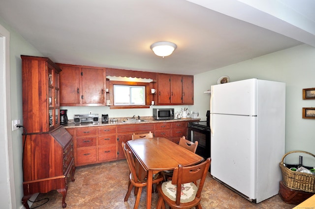 61 E St, Bethlehem, CT 06751 - kitchen featuring freestanding refrigerator, stainless steel microwave, a sink, black electric range, and light countertops
