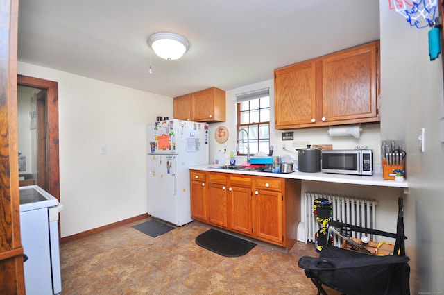 61 E St, Bethlehem, CT 06751 - kitchen with freestanding refrigerator, stainless steel microwave, range, light countertops, and brown cabinets