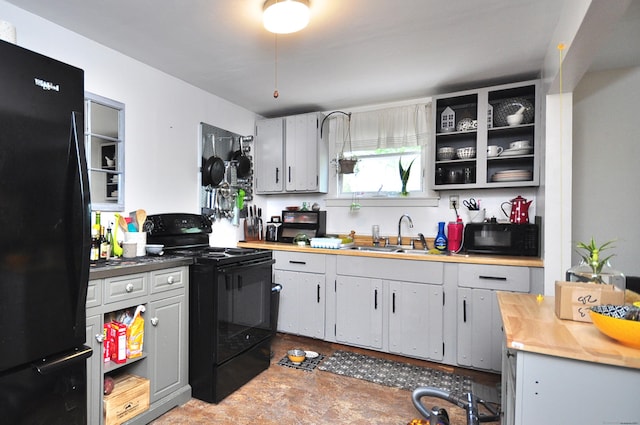 61 E St, Bethlehem, CT 06751 - kitchen with black appliances, a sink, and light countertops