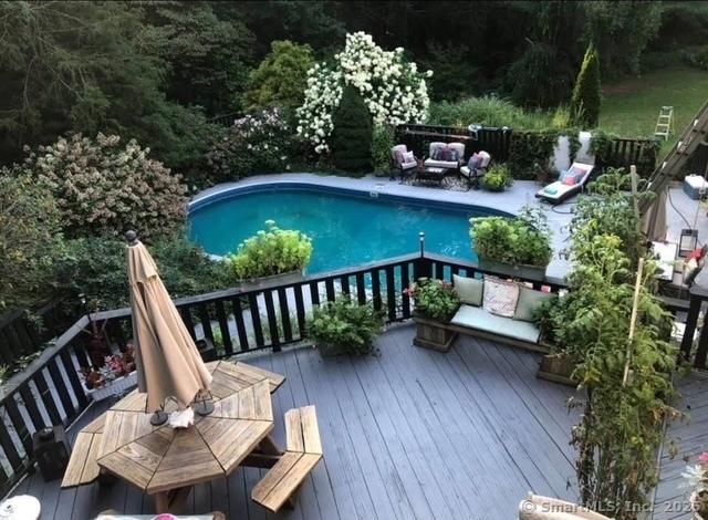 135 Wildwood Dr, Stratford, CT 06614 - exterior space featuring an outdoor hangout area and a fenced in pool
