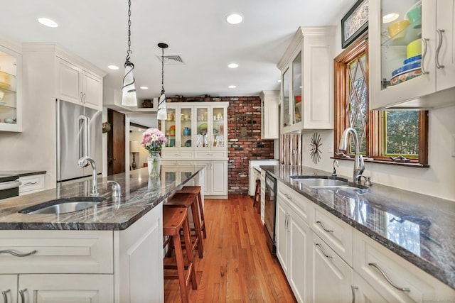 135 Wildwood Dr, Stratford, CT 06614 - kitchen with high end fridge, a sink, visible vents, and recessed lighting