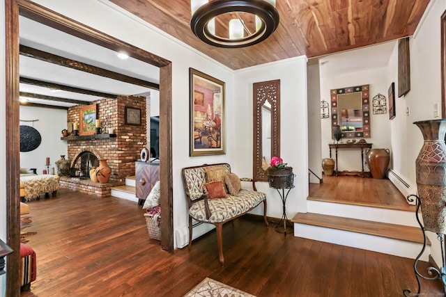 135 Wildwood Dr, Stratford, CT 06614 - sitting room with a baseboard heating unit, a brick fireplace, hardwood / wood-style floors, and wood ceiling