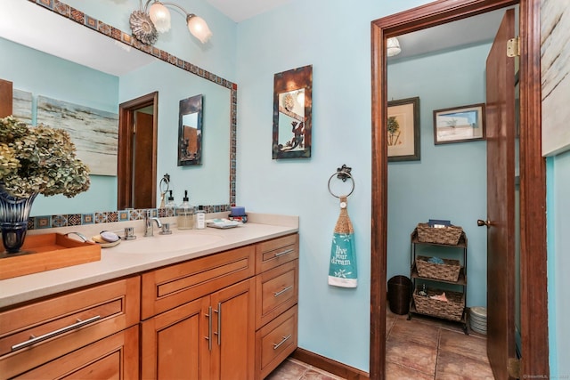135 Wildwood Dr, Stratford, CT 06614 - bathroom with baseboards, vanity, and tile patterned flooring