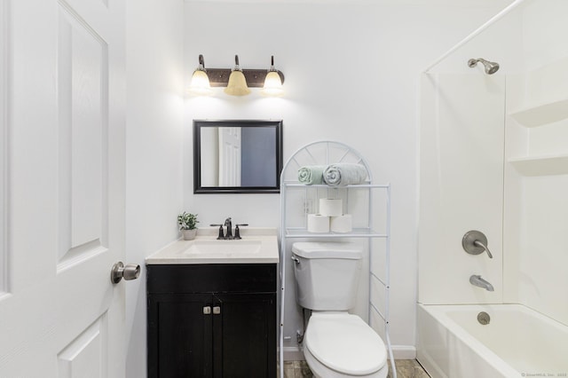 bathroom featuring toilet, vanity, and  shower combination