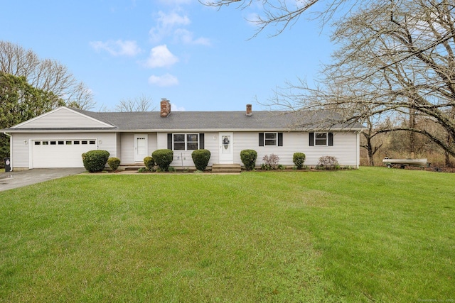 ranch-style home with a chimney, a garage, a front yard, and driveway