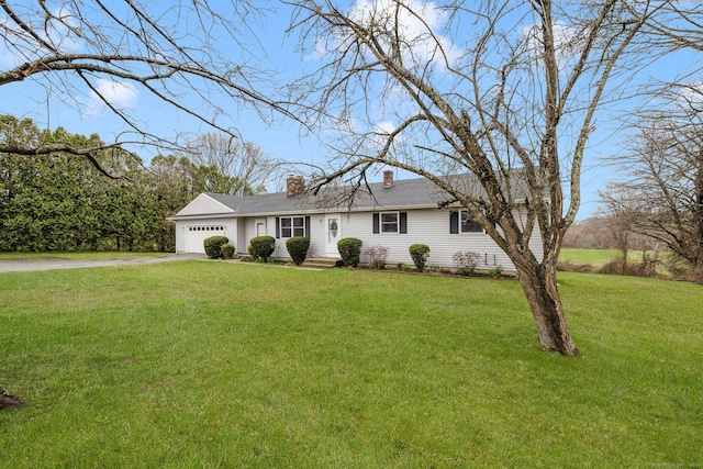 ranch-style home with a front yard, driveway, a chimney, and an attached garage
