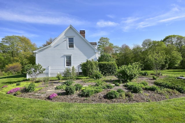 40 Shields Rd, Woodstock, CT 06281 - view of home's exterior featuring a chimney and a lawn