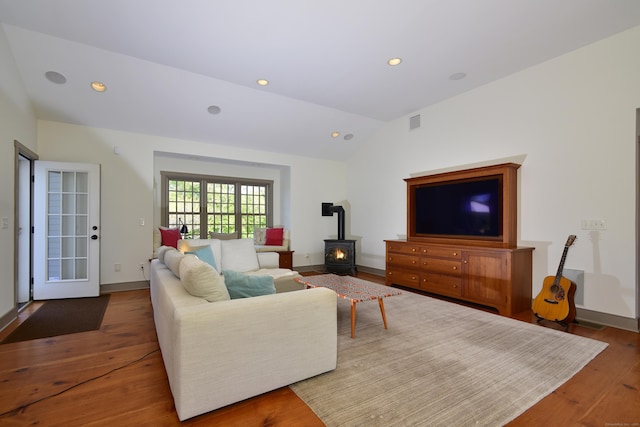 40 Shields Rd, Woodstock, CT 06281 - living area with a wood stove, lofted ceiling, wood finished floors, recessed lighting, and baseboards