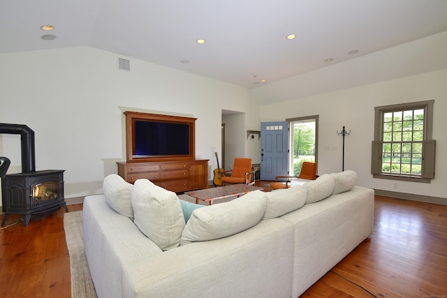 40 Shields Rd, Woodstock, CT 06281 - living area with lofted ceiling, wood finished floors, a wood stove, and recessed lighting
