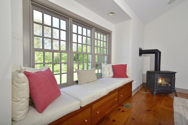 40 Shields Rd, Woodstock, CT 06281 - living area featuring a wood stove, healthy amount of natural light, light wood-style floors, and baseboards
