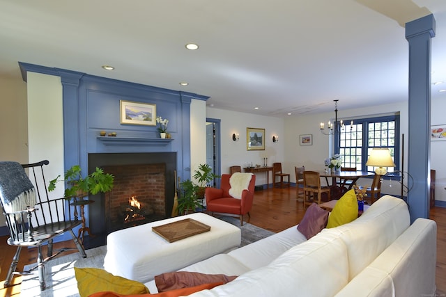 40 Shields Rd, Woodstock, CT 06281 - living room featuring wood finished floors, a fireplace, a chandelier, and recessed lighting