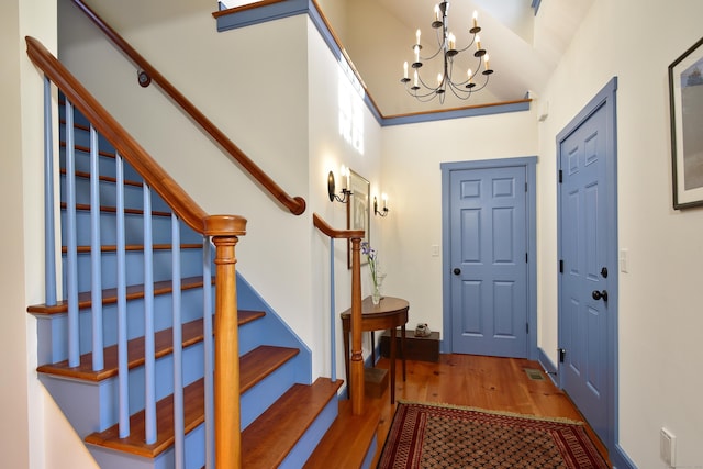 40 Shields Rd, Woodstock, CT 06281 - foyer with wood finished floors, a chandelier, and stairs