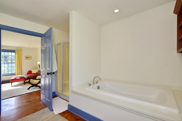 40 Shields Rd, Woodstock, CT 06281 - full bathroom featuring wood finished floors, a stall shower, a garden tub, and recessed lighting