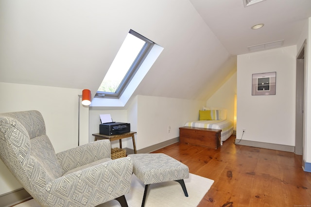 40 Shields Rd, Woodstock, CT 06281 - living area with lofted ceiling, a skylight, wood finished floors, and baseboards