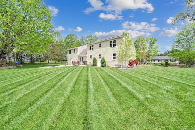 back of house with a yard