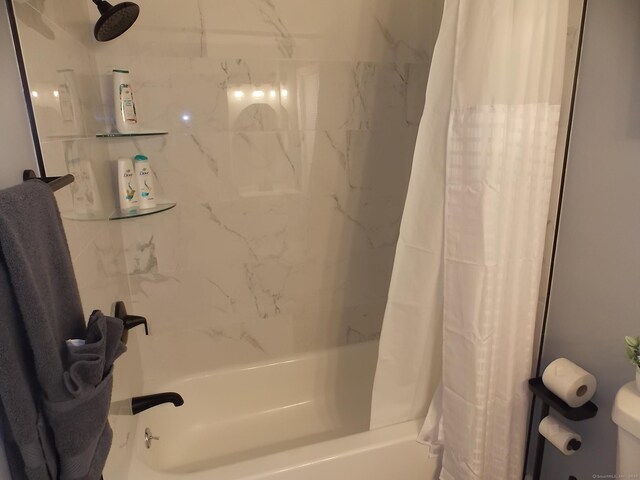 full bath with toilet and shower / tub combo