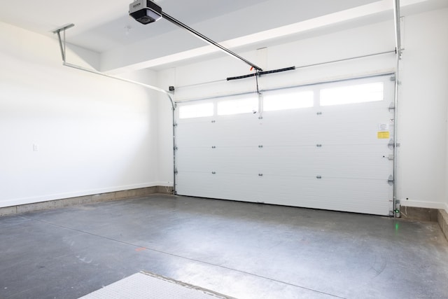 25 Oakwood Cir Unit 7, Plainville, CT 06062 - garage featuring baseboards and a garage door opener