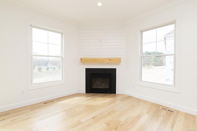 25 Oakwood Cir Unit 7, Plainville, CT 06062 - unfurnished living room featuring visible vents, ornamental molding, wood finished floors, and a large fireplace