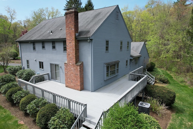 32 Woodmont Rd, Avon, CT 06001 - rear view of property featuring central AC, a chimney, roof with shingles, and a deck