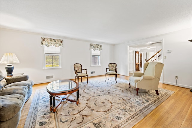32 Woodmont Rd, Avon, CT 06001 - living area featuring light wood finished floors, baseboards, and stairs