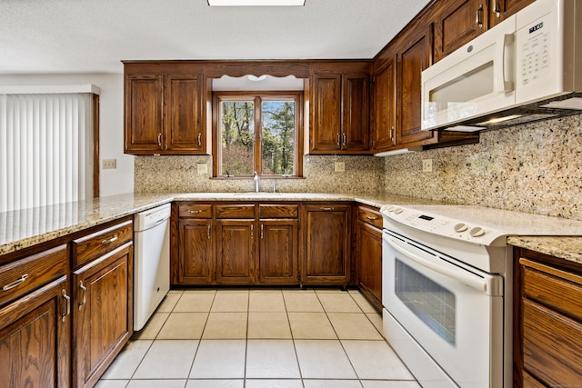 32 Woodmont Rd, Avon, CT 06001 - kitchen with white appliances, backsplash, light stone counters, and light tile patterned flooring