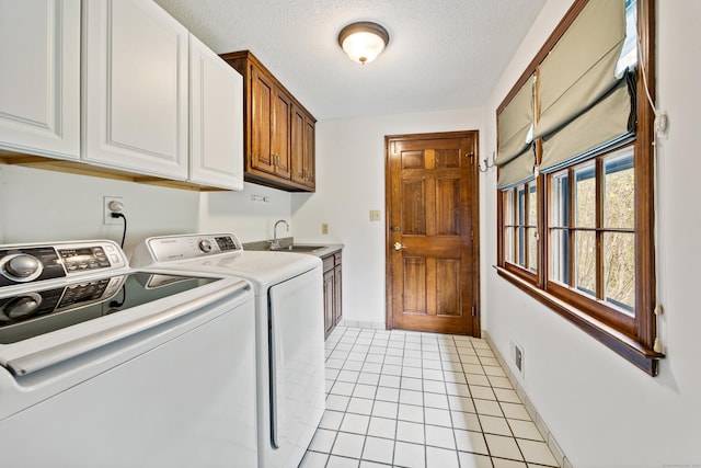 32 Woodmont Rd, Avon, CT 06001 - laundry area with independent washer and dryer, cabinet space, a textured ceiling, and light tile patterned flooring