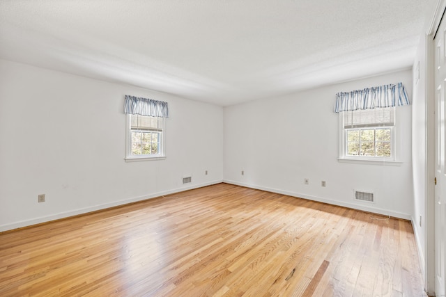 32 Woodmont Rd, Avon, CT 06001 - empty room featuring healthy amount of natural light, light wood-type flooring, and baseboards