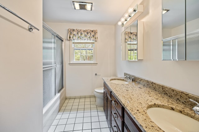 32 Woodmont Rd, Avon, CT 06001 - full bath with toilet, tile patterned flooring, double vanity, and combined bath / shower with glass door